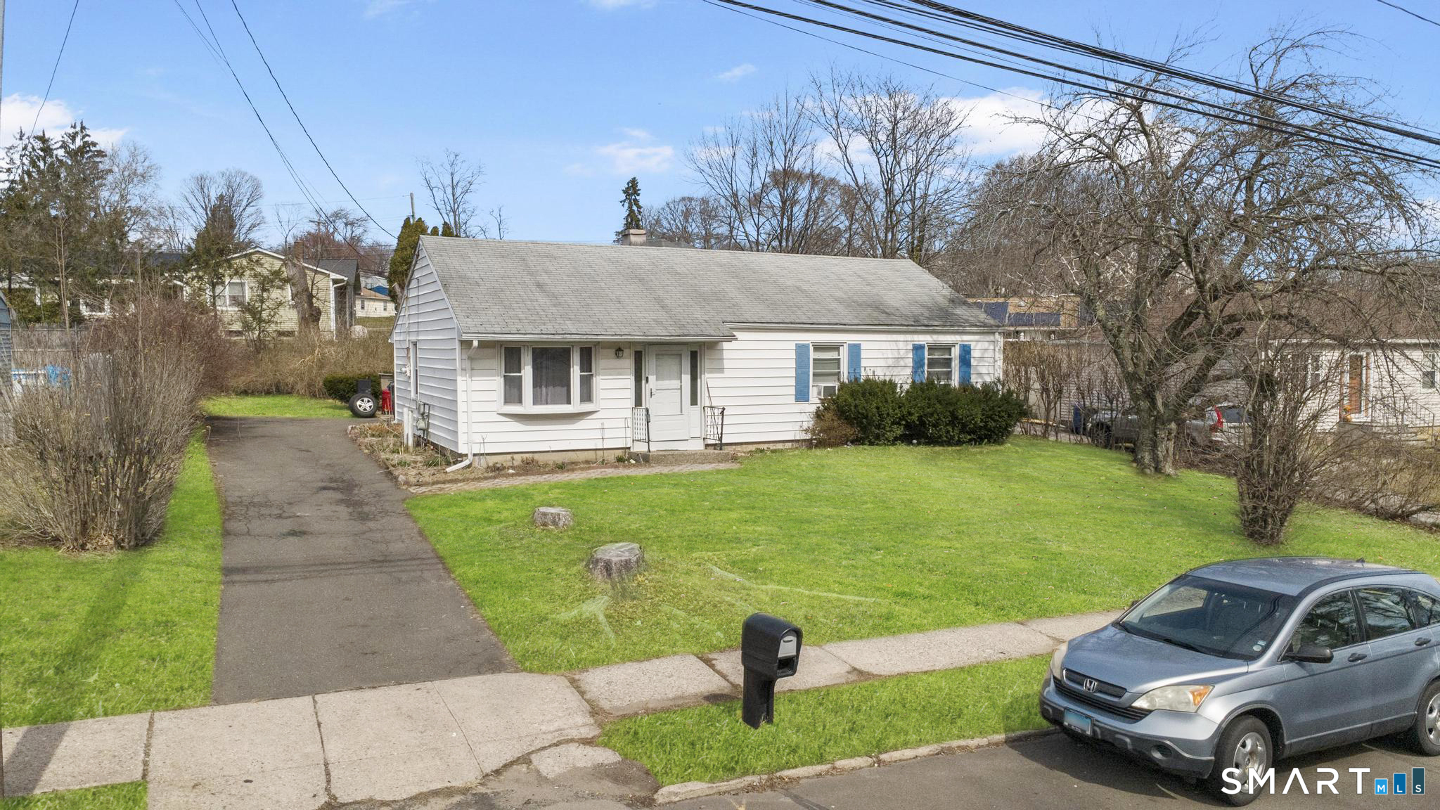 472 Anton Street Bridgeport, CT 06606 - Photo 18 of 23 a front view of a house with garden