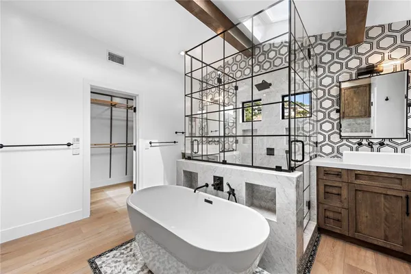 a bathroom with a sink and mirror