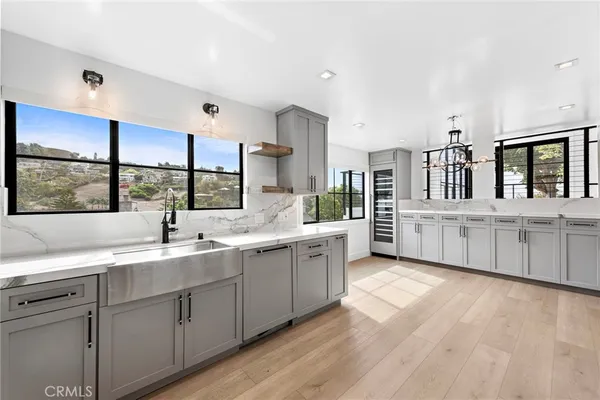 a kitchen with counter top space sink and center