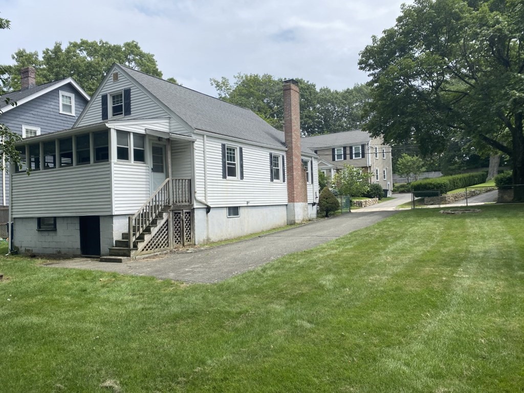 45 Glenellen Road Boston, MA 02132 - Photo 2 of 10 a front view of a house with a yard and porch