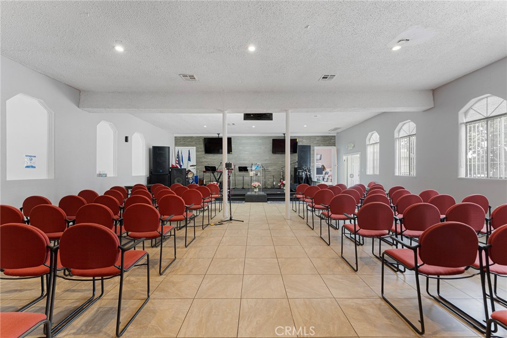 6408 Perry Road Bell Gardens, CA 90201 - Photo 18 of 32 a living room with furniture and kitchen view