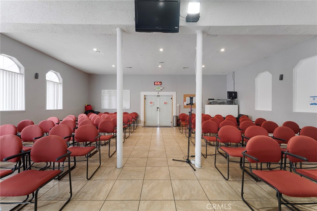 6408 Perry Road Bell Gardens, CA 90201 - Photo 19 of 32 a living room with furniture and a flat screen tv