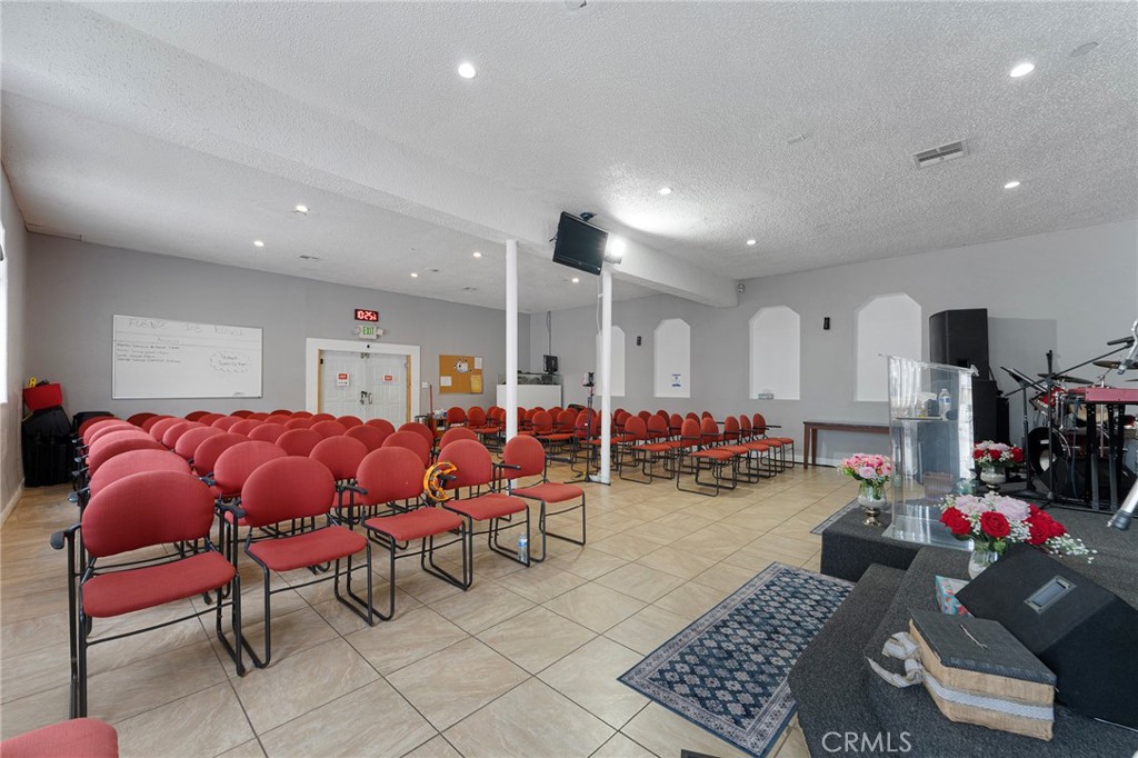6408 Perry Road Bell Gardens, CA 90201 - Photo 21 of 32 a living room with lots of furniture and a couch
