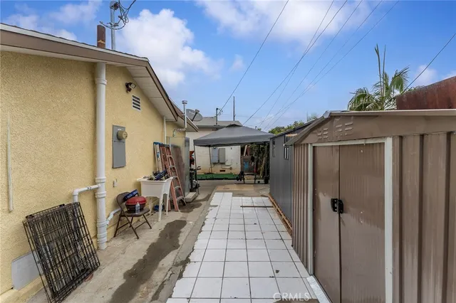 a view of a patio with table and chairs