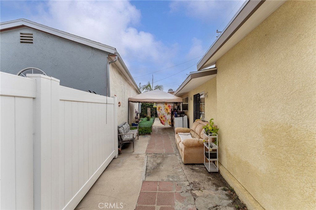 6408 Perry Road Bell Gardens, CA 90201 - Photo 5 of 32 a view of a patio with table and chairs