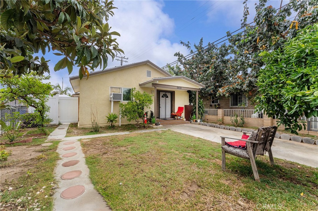6408 Perry Road Bell Gardens, CA 90201 - Photo 6 of 32 a view of a backyard with table and chairs and potted plants