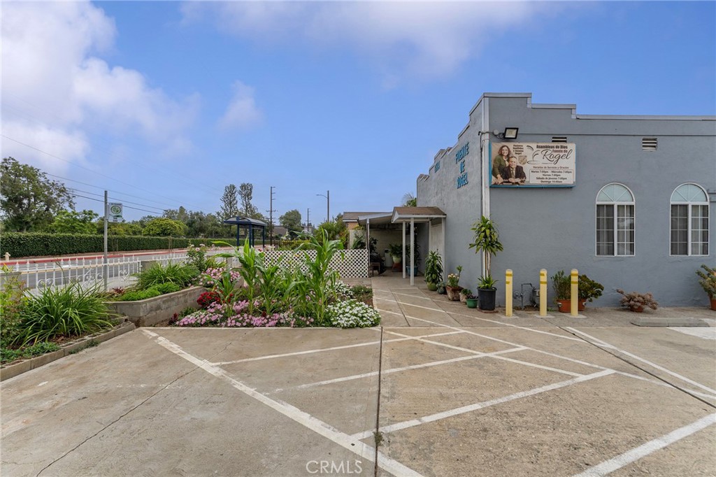 6408 Perry Road Bell Gardens, CA 90201 - Photo 10 of 32 a view of a patio with couches and table and chairs and potted plants