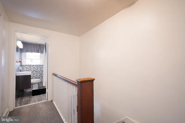 a view of a bathroom from a hallway