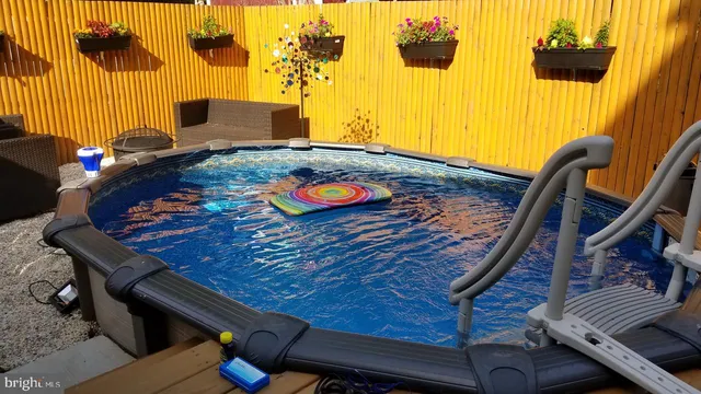 a view of a room with furniture and wooden floor