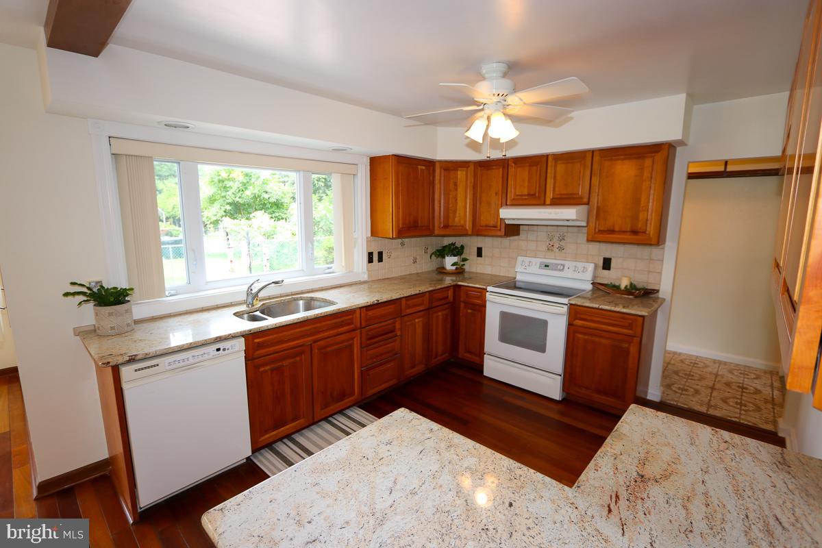 2068 Clinton Road Huntingdon Valley, PA 19006 - Photo 16 of 65 Modern kitchen w wood cabinets & granite counters
