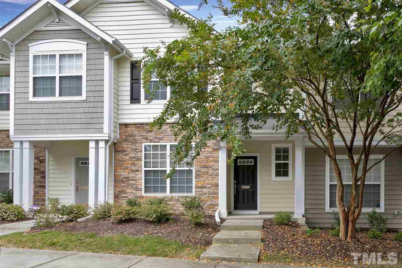369 Red Elm Drive Durham, NC 27713 - Photo 1 of 29 a front view of a house with a yard and potted plants
