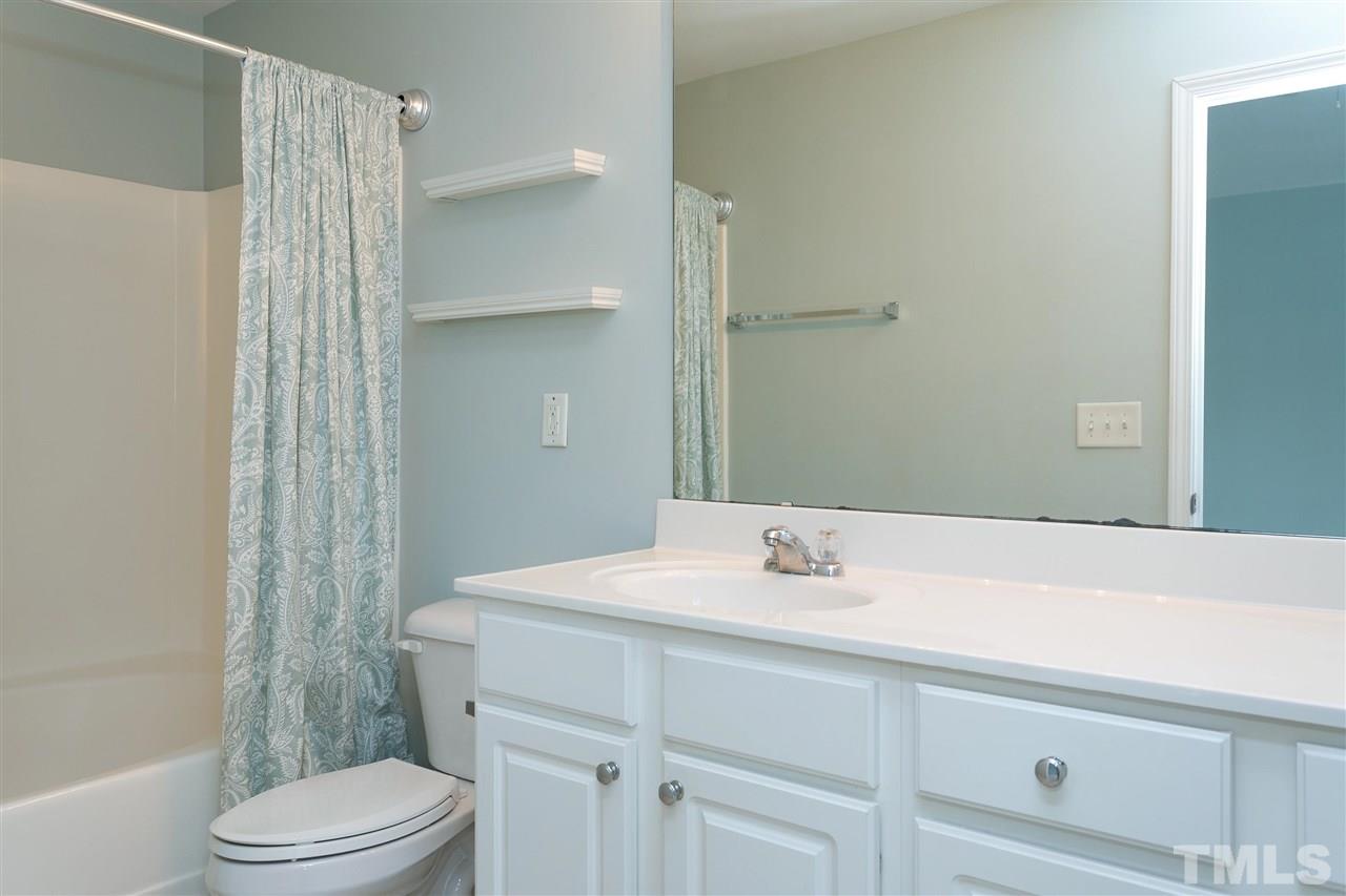 369 Red Elm Drive Durham, NC 27713 - Photo 17 of 29 a bathroom with a sink a toilet and shower