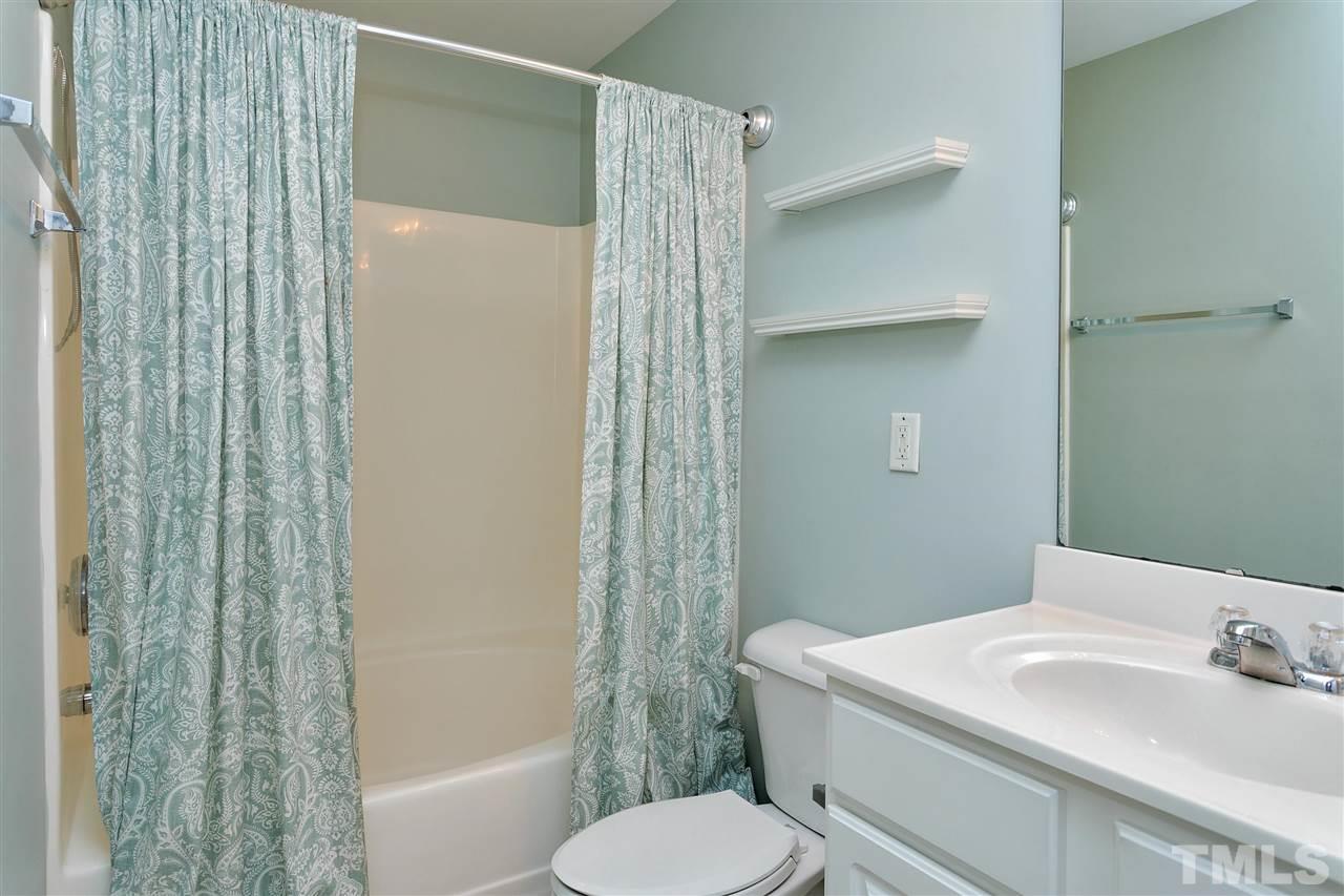 369 Red Elm Drive Durham, NC 27713 - Photo 18 of 29 a bathroom with a sink toilet and shower