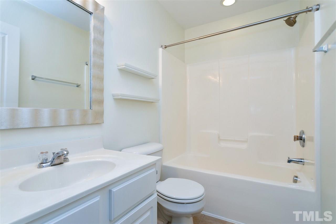 369 Red Elm Drive Durham, NC 27713 - Photo 24 of 29 a bathroom with a sink toilet and shower