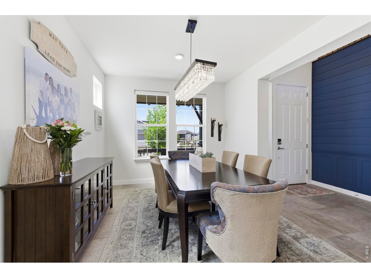 2910 Water View Street Timnath, CO 80547 - Photo 6 of 50 a view of a dining room with furniture and a potted plant