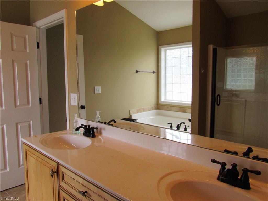 4604 River Valley Road High Point, NC 27265 - Photo 10 of 20 Master bath with his and her sinks, garden tub and separate shower.