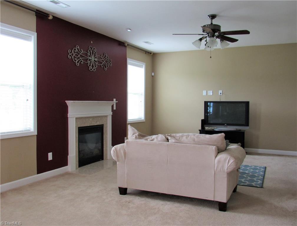 4604 River Valley Road High Point, NC 27265 - Photo 5 of 20 Large family room opens to breakfast/kitchen area. Gas logs fireplace is perfect for taking the chill off on winter days.