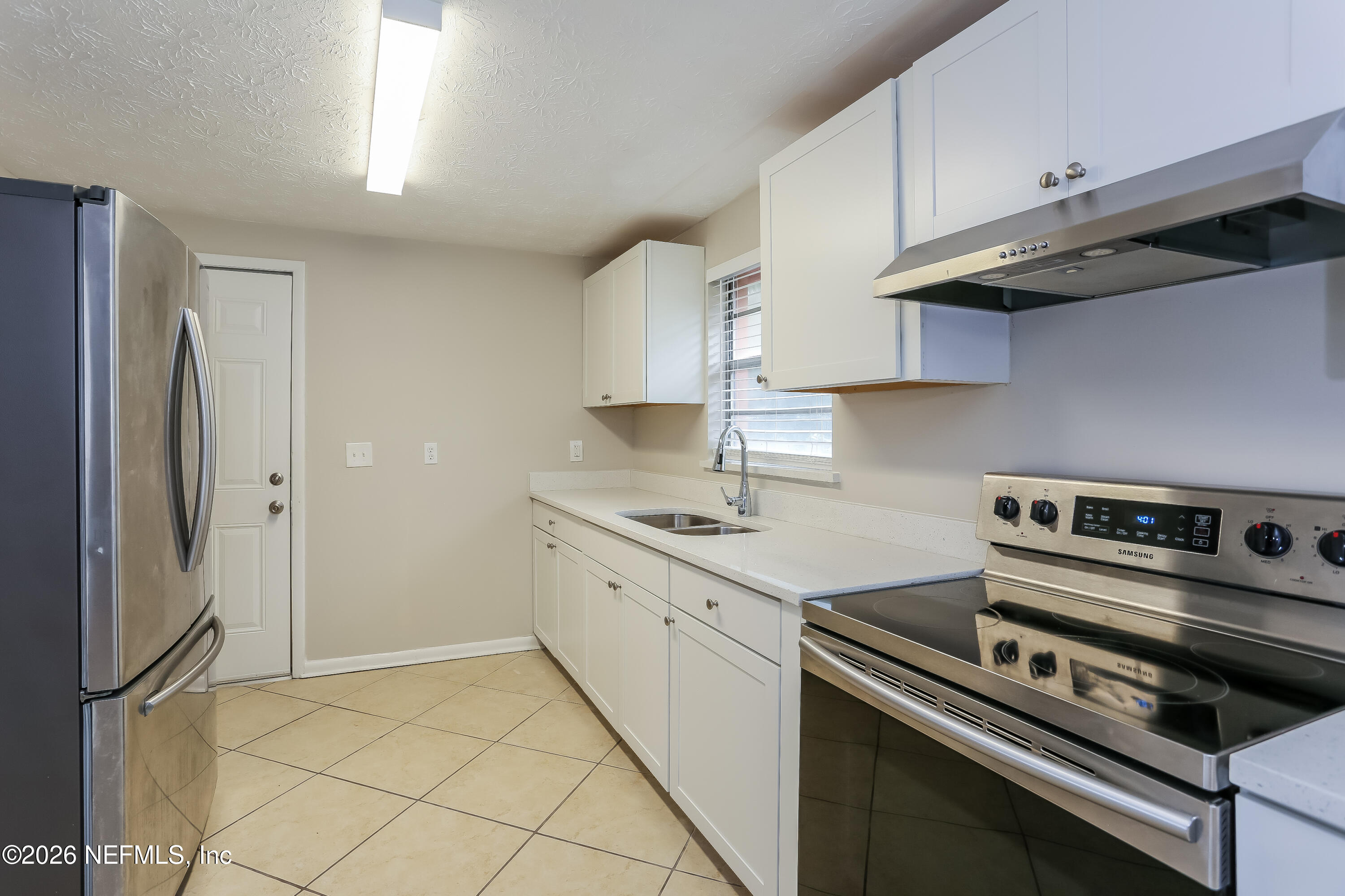 9572 Spottswood Road West Jacksonville, FL 32208 - Photo 6 of 16 006-photo-kitchen-10044547