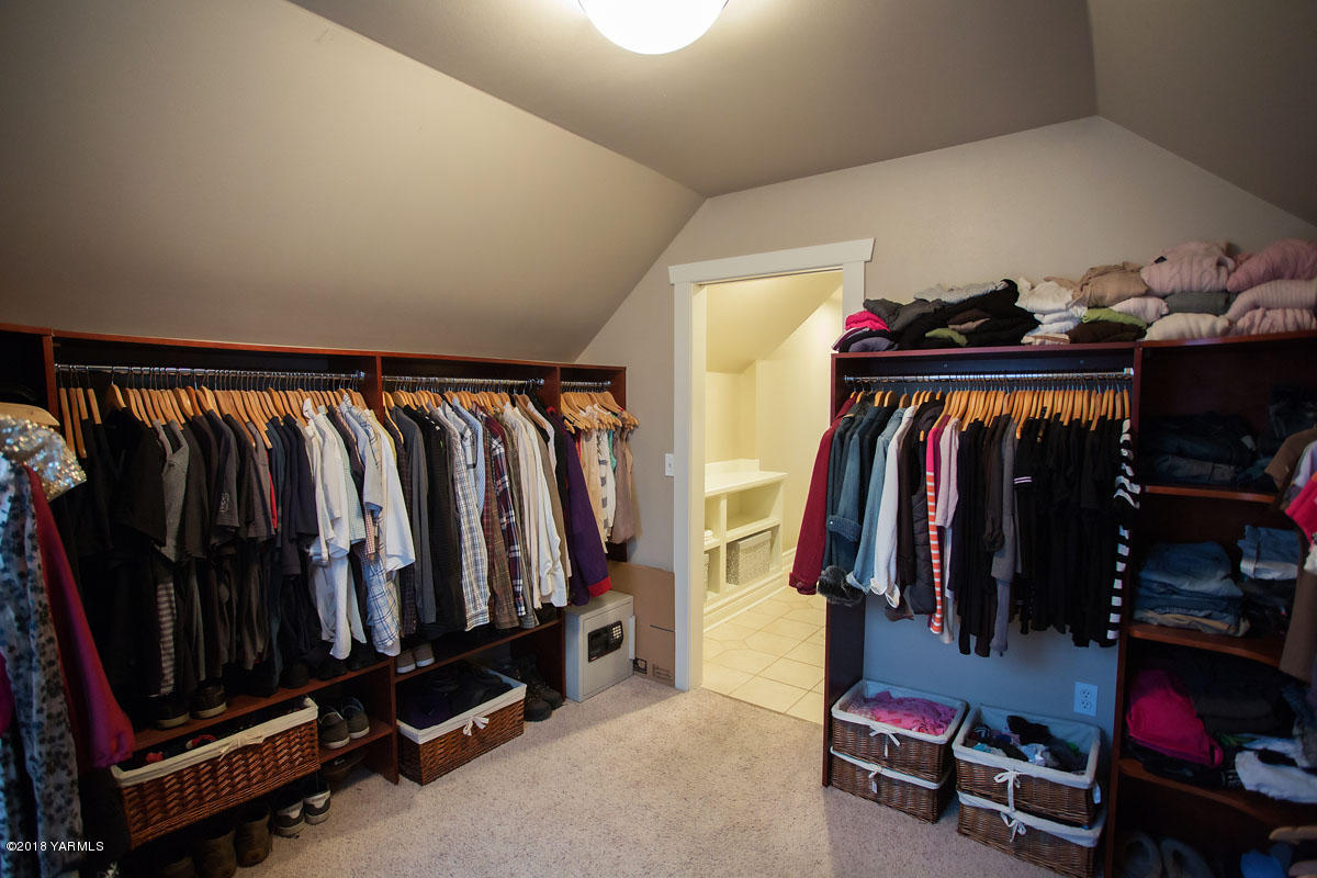 14750 Fisk Road Yakima, WA 98908 - Photo 27 of 35 a view of walk in closet with clothes and shoes