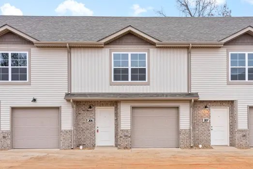 940 Britton Springs Road, Unit 305 Clarksville, TN 37042 - Photo 1 of 30 a front view of a house with a yard and garage