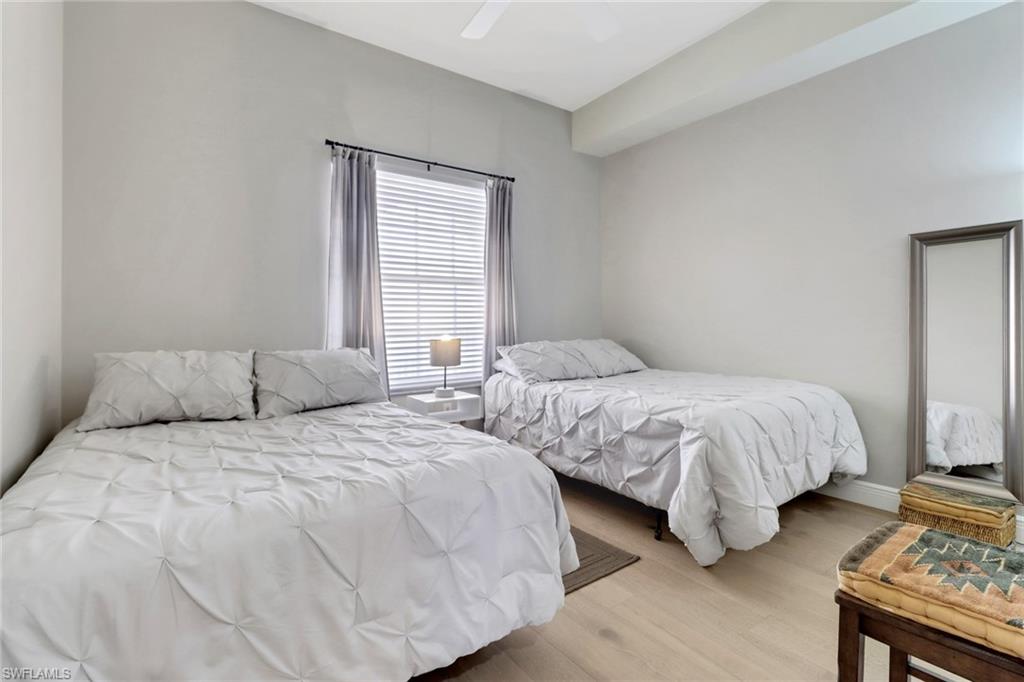 401 Bayfront Place, Unit 3502 Naples, FL 34102 - Photo 10 of 22 Bedroom with light wood finished floors and a ceiling fan