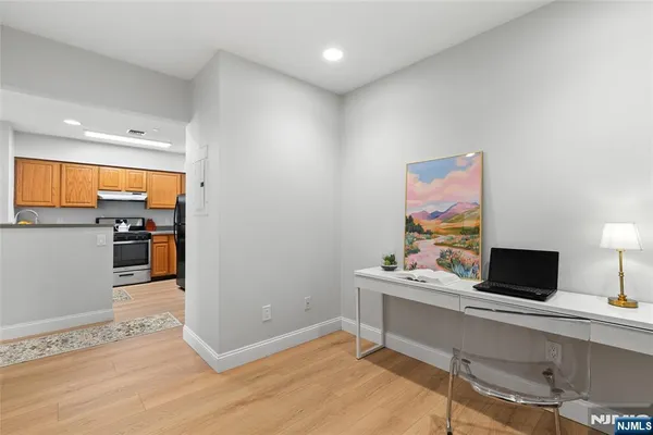 a workspace with furniture and wooden floor