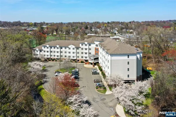 an aerial view of a house with a lake view