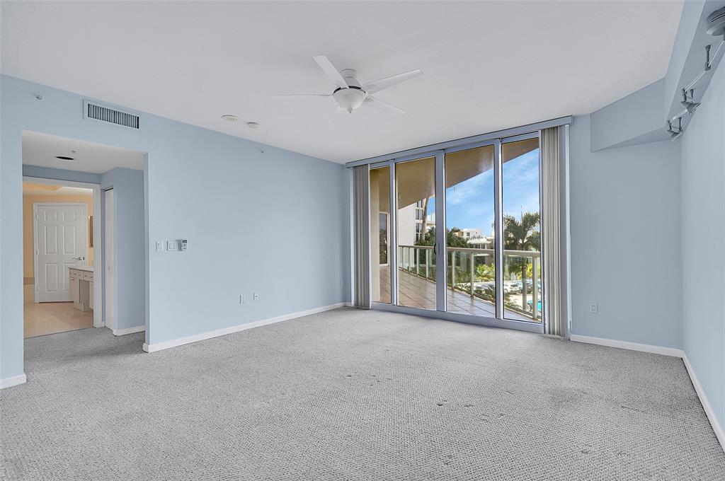 6001 North Ocean Drive, Unit 403 Hollywood, FL 33019 - Photo 16 of 58 a view of an empty room with a sliding door