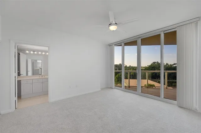 en empty room with sliding glass door and glass door