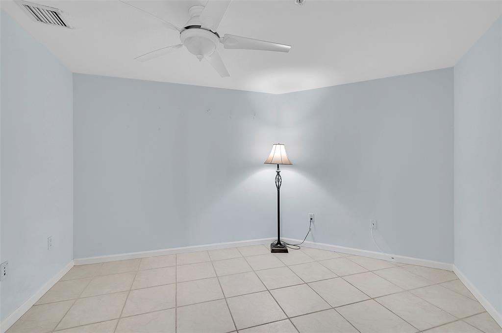 6001 North Ocean Drive, Unit 403 Hollywood, FL 33019 - Photo 21 of 58 a view of an empty room and a chandelier fan