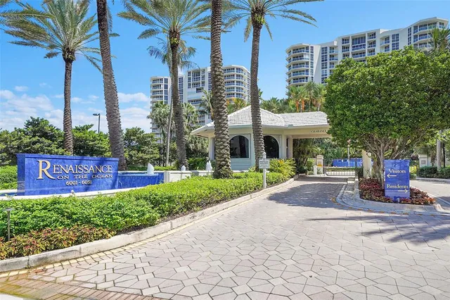 a swimming pool with outdoor seating yard and trees