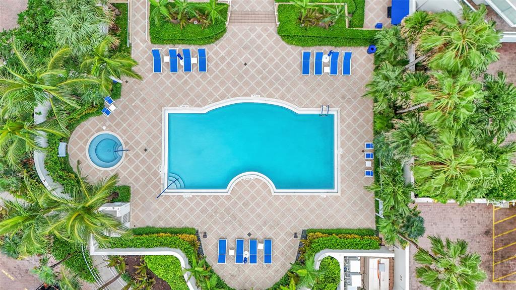 6001 North Ocean Drive, Unit 403 Hollywood, FL 33019 - Photo 37 of 58 a front view of a house with a yard and plants