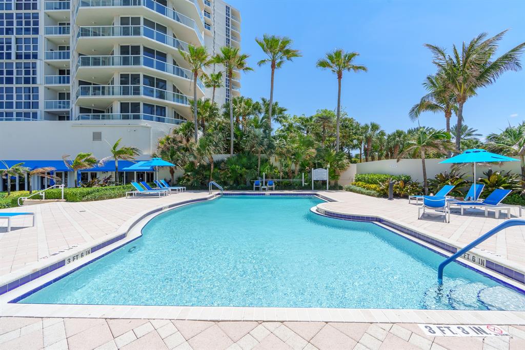 6001 North Ocean Drive, Unit 403 Hollywood, FL 33019 - Photo 42 of 58 a view of a swimming pool with a garden
