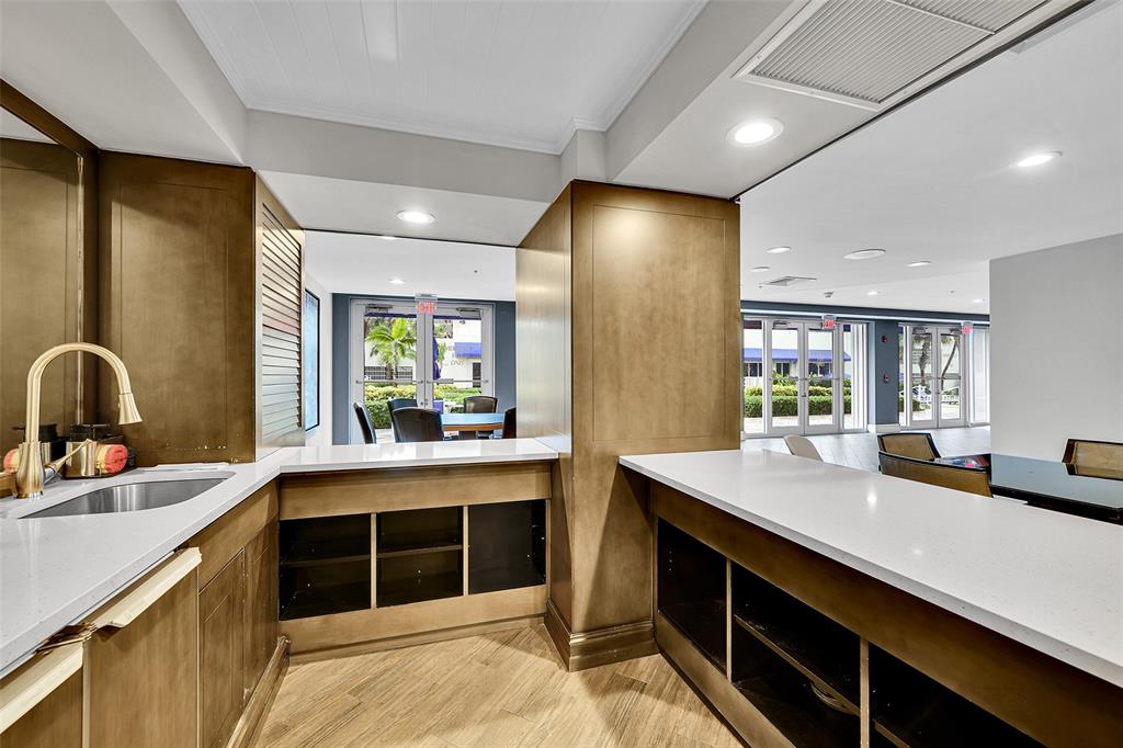 6001 North Ocean Drive, Unit 403 Hollywood, FL 33019 - Photo 54 of 58 a large kitchen with stainless steel appliances a sink and a large window