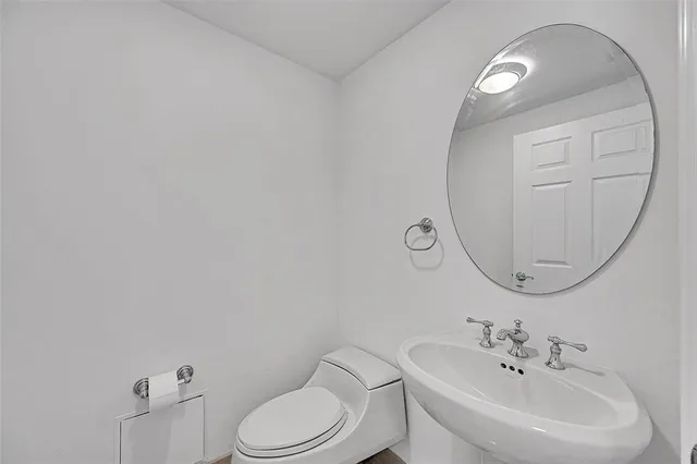a view of kitchen with granite countertop cabinets and sink