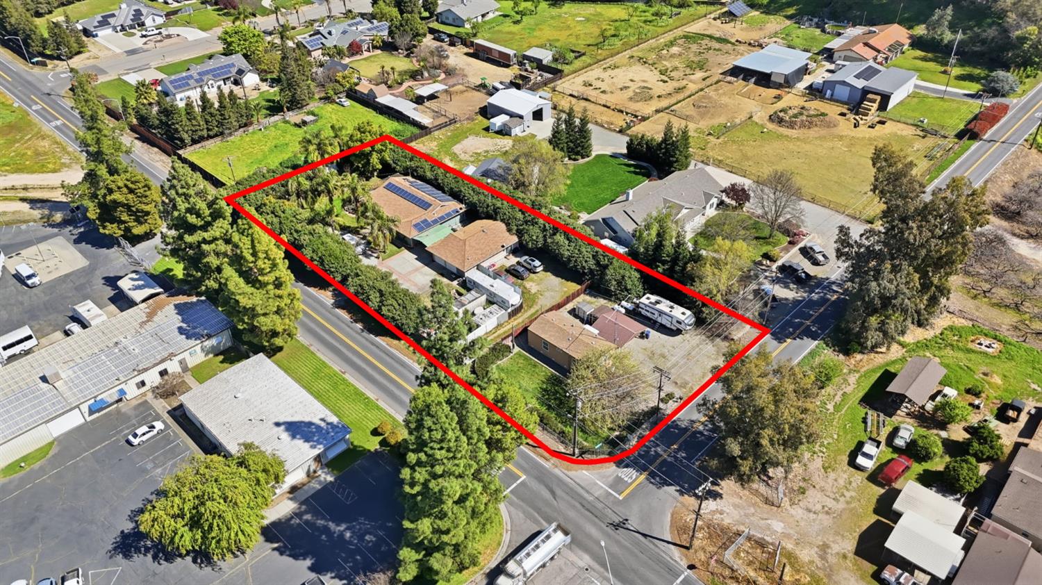 an aerial view of a residential houses with outdoor space