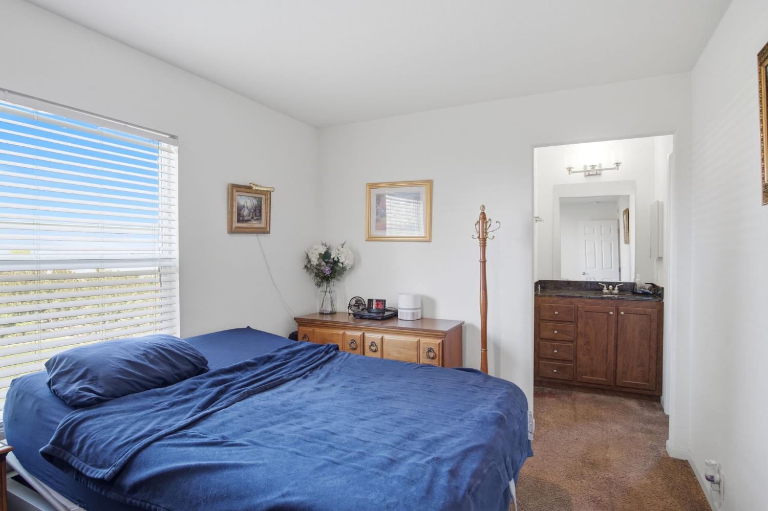 6176 Fleming Road Atwater, CA 95301 - Photo 11 of 41 a bedroom with a bed and furniture