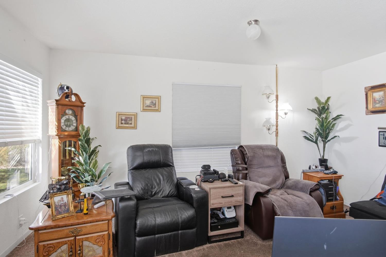 6176 Fleming Road Atwater, CA 95301 - Photo 15 of 41 a living room with furniture and a potted plant