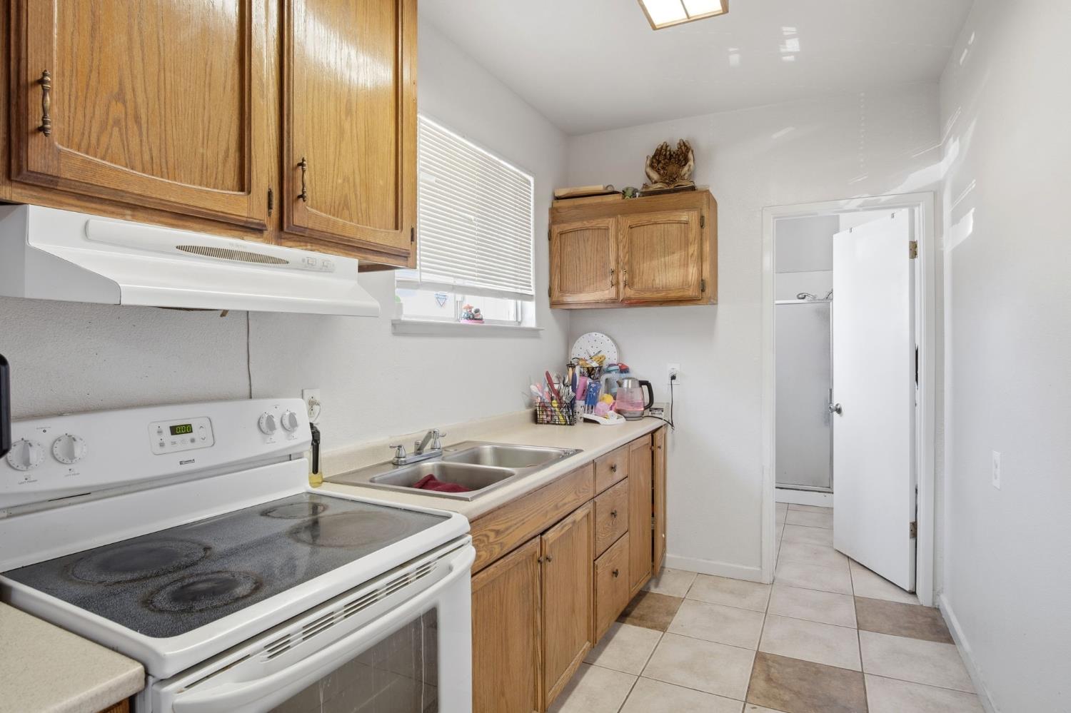 6176 Fleming Road Atwater, CA 95301 - Photo 18 of 41 a kitchen with a sink stove and cabinets