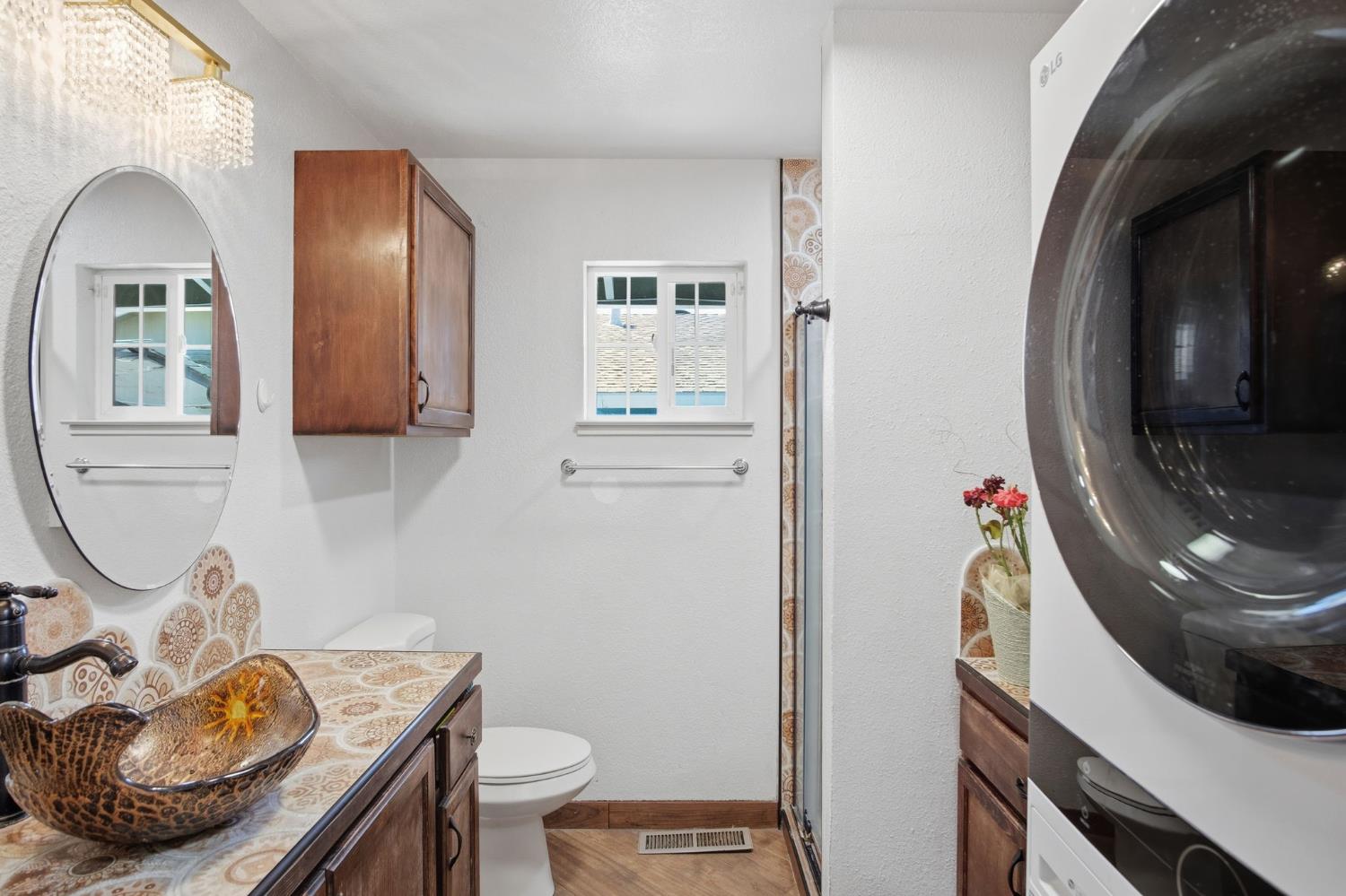 6176 Fleming Road Atwater, CA 95301 - Photo 34 of 41 a bathroom with a toilet a sink and mirror