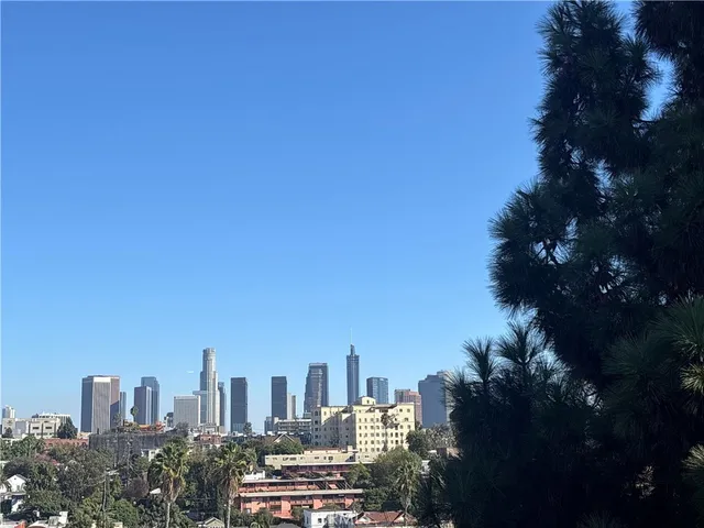 a view of a city with tall buildings in the background
