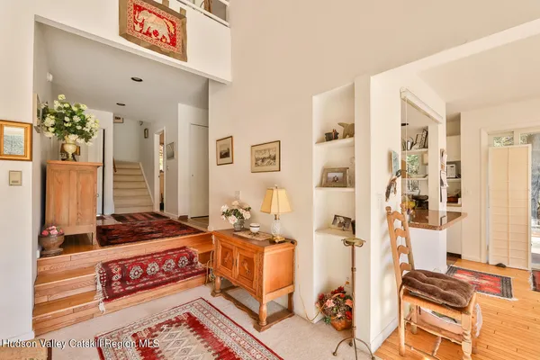 a bedroom with furniture and a window