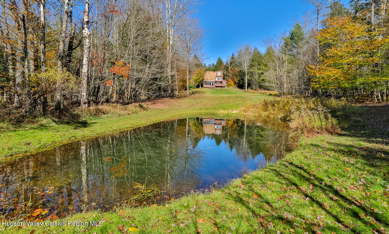 91 Beaver Hill Road Windham, NY 12496 - Photo 19 of 35 a view of a lake with a yard