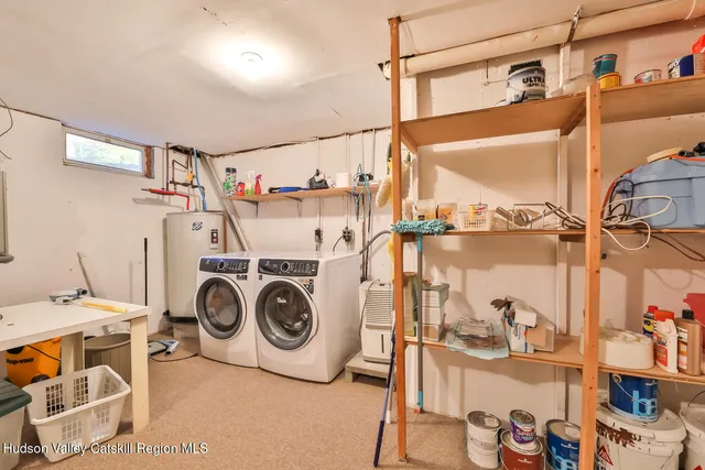 a utility room with sink dryer and washer