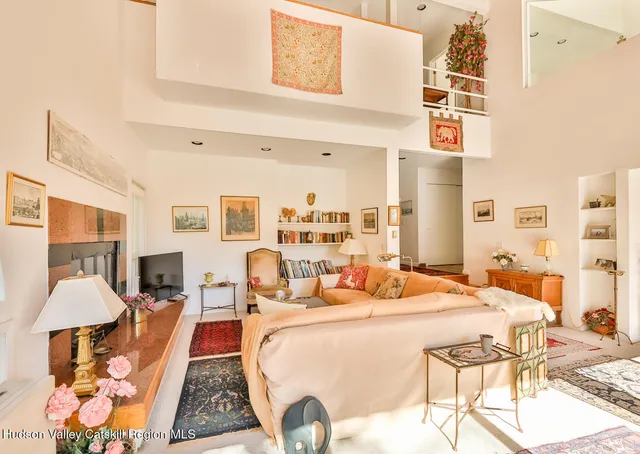 a bedroom with furniture and a lamp