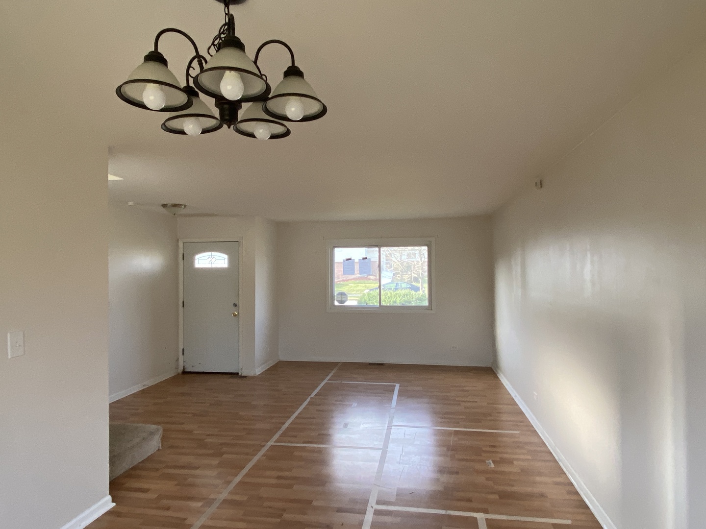 43 Pheasant Road Matteson, IL 60443 - Photo 4 of 11 a view of a room with wooden floor chandeliers and window