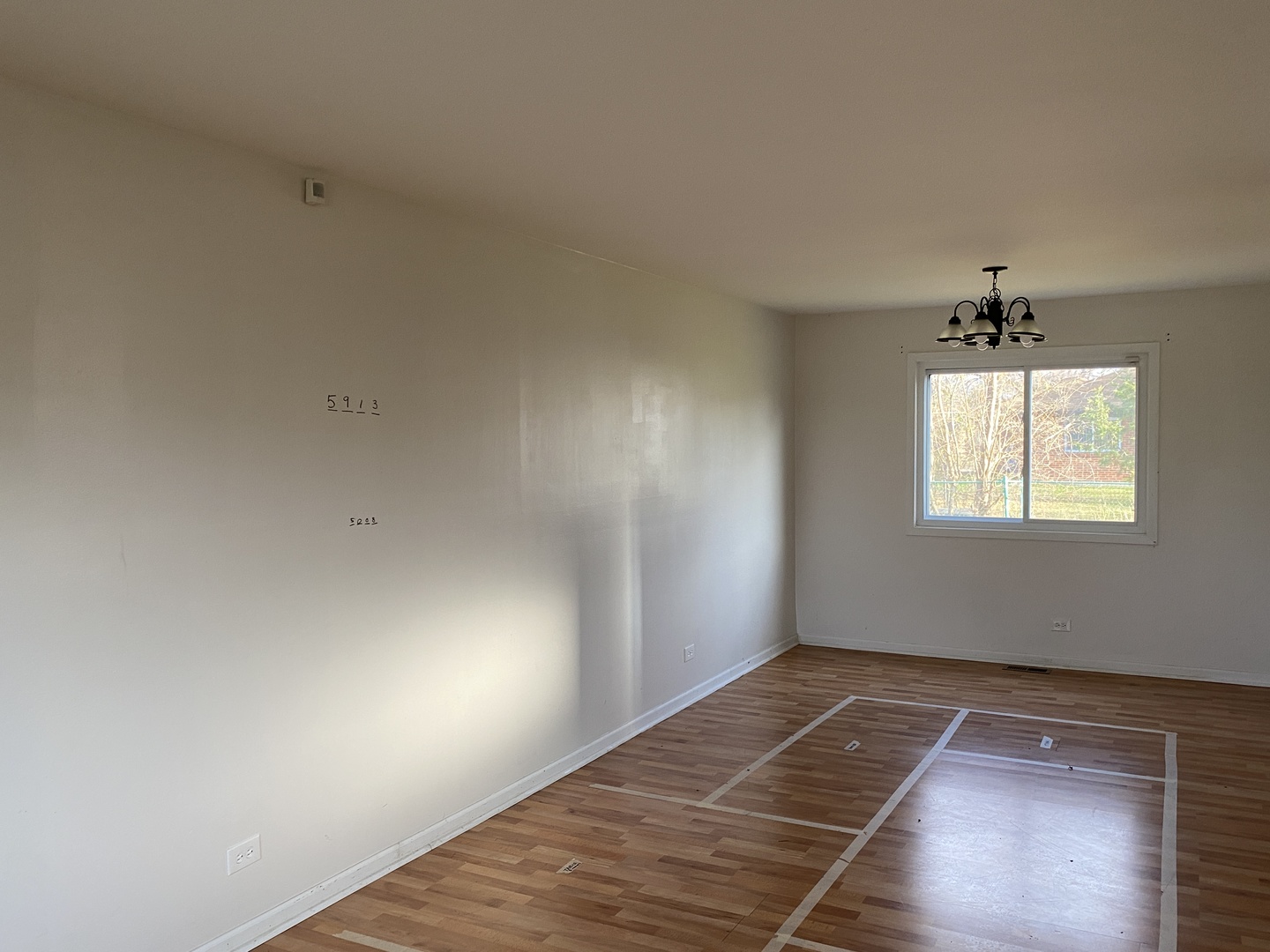 43 Pheasant Road Matteson, IL 60443 - Photo 5 of 11 a view of an empty room with wooden floor and a window