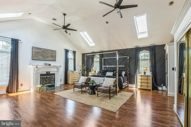 a living room with furniture fireplace and flat screen tv