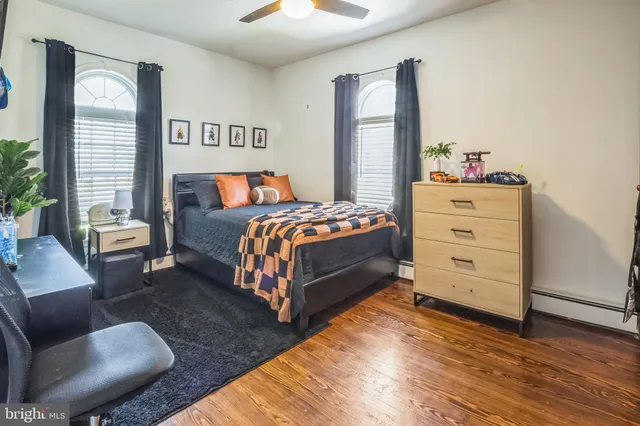 a bedroom with a bed and a couch