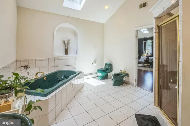 a white bath tub sitting in a bathroom